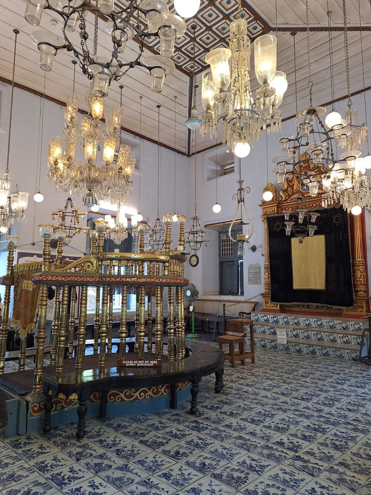 Interior of Paradesi Synagogue with Belgian glass chandeliers and floor tiles