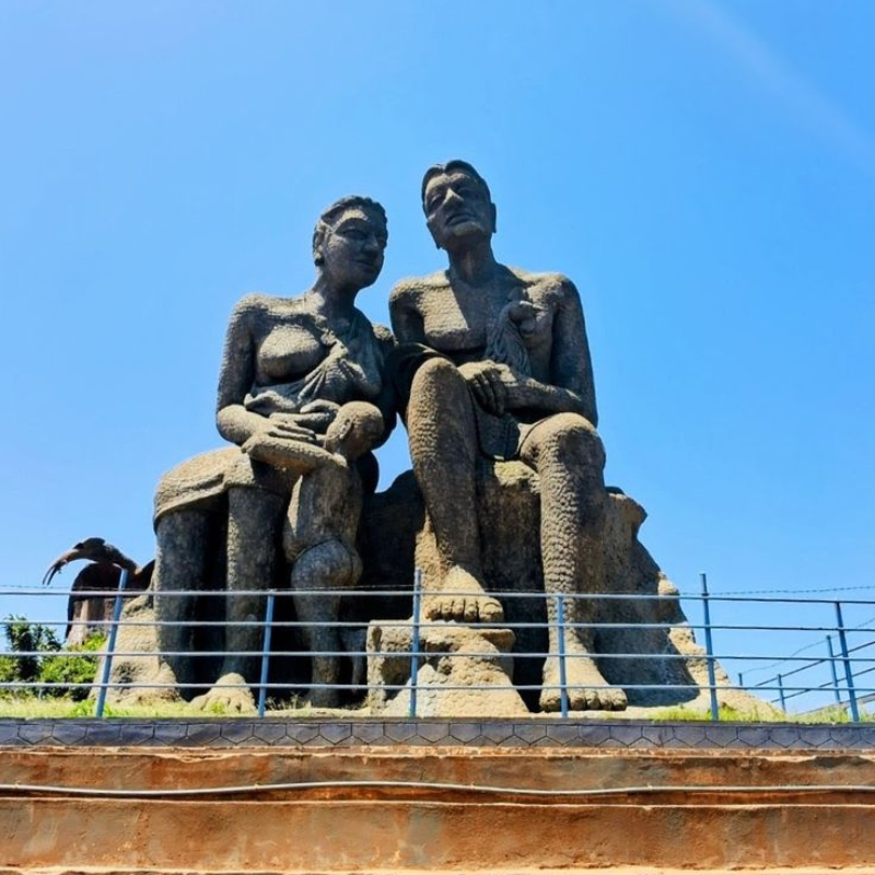 Large stone statues at Ramakkalmedu viewpoint overlooking the valley